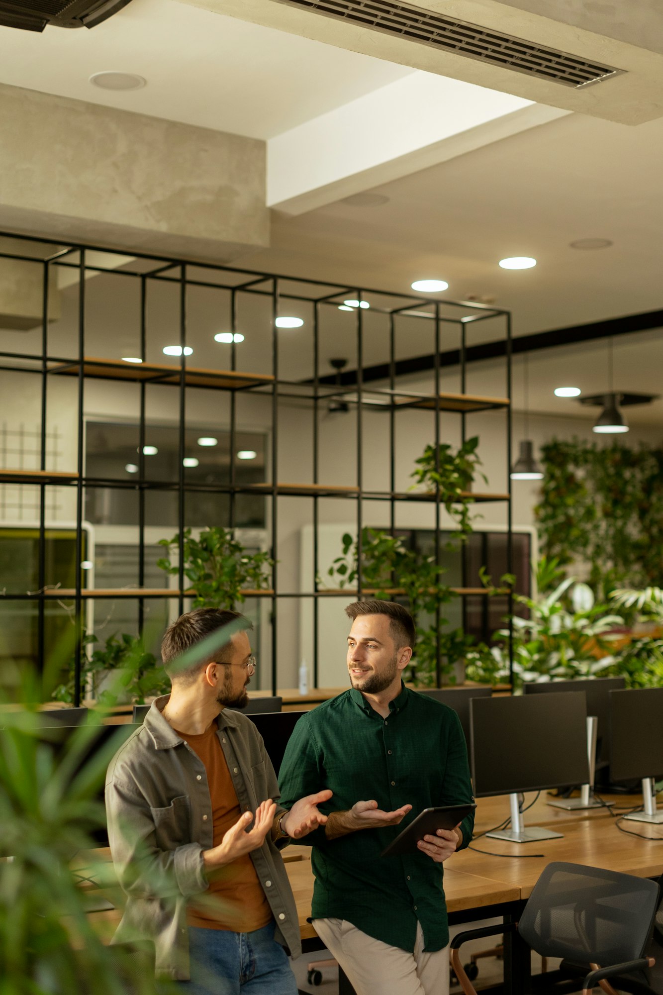 Collaborative Discussion in a Modern Office With Exposed Brick Walls